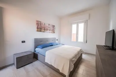 Letto o letti in una camera di Smart Life House in the heart of Modena