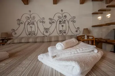 Letto o letti in una camera di 211B - Appartamento Acacia, Terrazza Giardino e Piscina