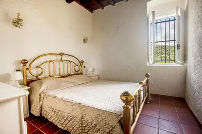 Letto o letti in una camera di 277B - Il Frantoio della Marchesa - Giardino e Piscina nel verde di Sestri Levante