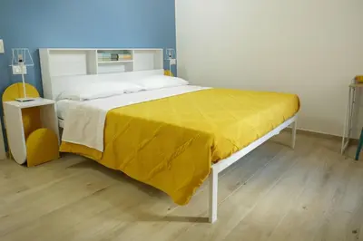 Letto o letti in una camera di Good Vibes apartment centro storico Reggio Emilia