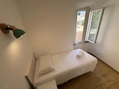 Letto o letti in una camera di Kiwi home in the historic center with a small terrace