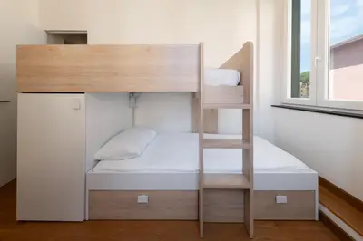 Letto o letti in una camera di Casa Tigullio