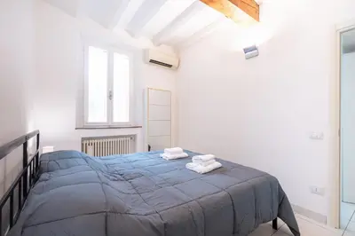 Letto o letti in una camera di GuestHost - Bright and Central Apartment in Parma