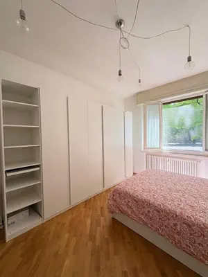 Letto o letti in una camera di Cozy Green Apartment Tardini, Parma