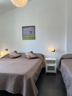 Letto o letti in una camera di Anne-Britt Home