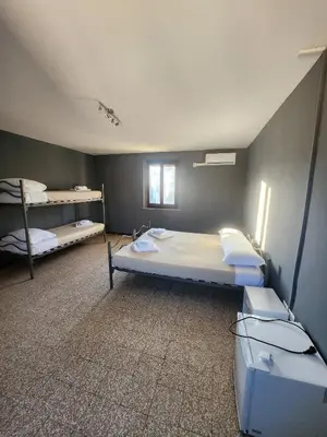 Letto o letti in una camera di Affittacamere LA BOUGANVILLE