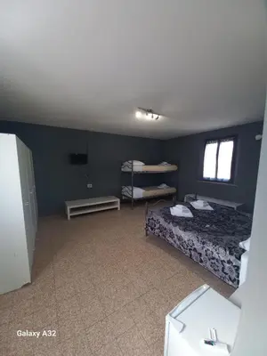 Letto o letti in una camera di Affittacamere LA BOUGANVILLE