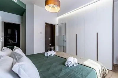 Letto o letti in una camera di Green Lux-Via Canalino- Pass ZTL Parking WiFi