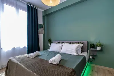 Letto o letti in una camera di Green Lux-Via Canalino- Pass ZTL Parking WiFi