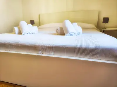 Letto o letti in una camera di Casa Matteotti By Vacanze in Chiavari