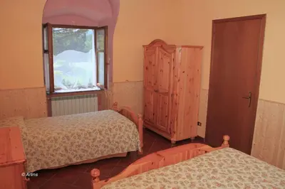 Letto o letti in una camera di Agriturismo La Praduscella