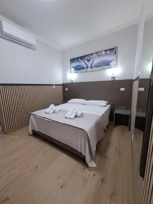 Letto o letti in una camera di Modena Hotel