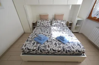 Letto o letti in una camera di La Casa di Elena by PortofinoVacanze