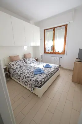 Letto o letti in una camera di La Casa di Elena by PortofinoVacanze