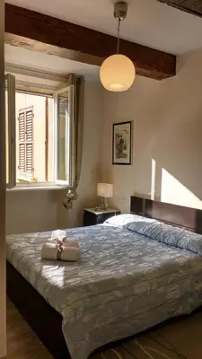 Letto o letti in una camera di Heart of Parma