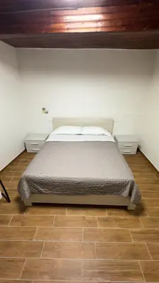 Letto o letti in una camera di Residenze del Borgo