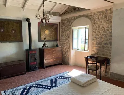 Letto o letti in una camera di B&B Torre di San Caprasio Art Studio