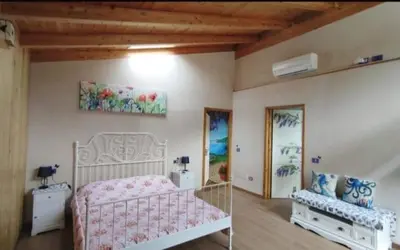 Letto o letti in una camera di La Libellula