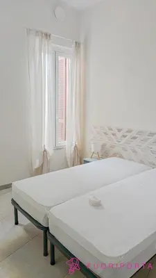 Letto o letti in una camera di FuoriPorta Affitti Brevi - Petit Jardin