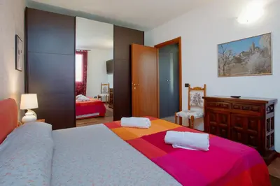Letto o letti in una camera di PARISI Borgo Virgilio