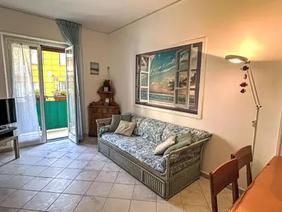 Area soggiorno di Apartment Baia dei Sogni by Interhome