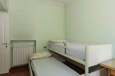 Letto o letti in una camera di Pit Stop MotorValley - Near Modena Old Town