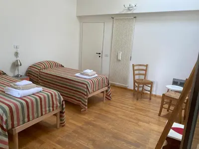 Letto o letti in una camera di Appartamento Nocciolo