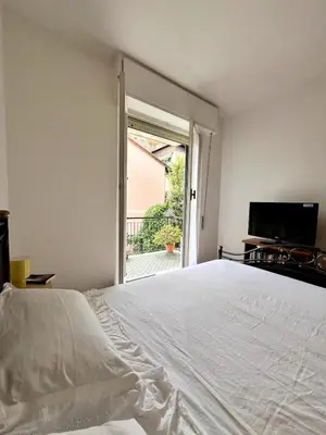 Letto o letti in una camera di Sun Apartment Rapallo