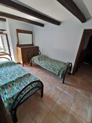 Letto o letti in una camera di Casa della Lupa