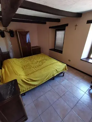 Letto o letti in una camera di Casa della Lupa