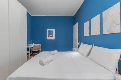 Letto o letti in una camera di 2 Min dal Bus per CNAO e Policlinico San Matteo - Parcheggio facile, Aria Condizionata