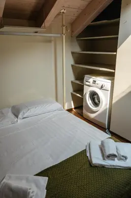 Letto o letti in una camera di Residenza Castello, con Ampio Garage Privato