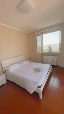 Letto o letti in una camera di Ampio appartamento centro storico