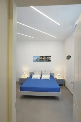 Letto o letti in una camera di Verdemare relax & rooms