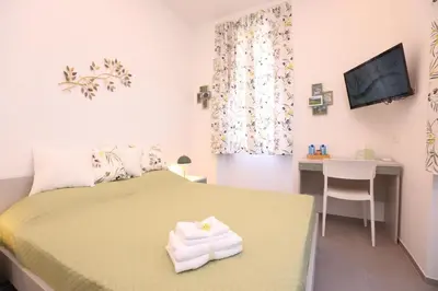 Letto o letti in una camera di Verdemare relax & rooms
