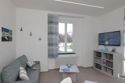 TV o dispositivi per l'intrattenimento presso Verdemare relax & rooms