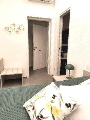 Letto o letti in una camera di Verdemare relax & rooms