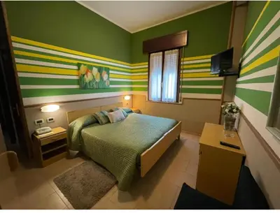 Letto o letti in una camera di Hotel Azzurra