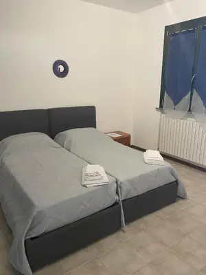 Letto o letti in una camera di Ami Affittacamere 2