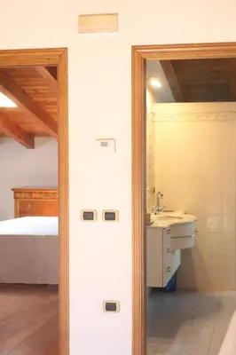 Letto o letti in una camera di Villa Paola - mansarda Glam -
