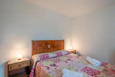 Letto o letti in una camera di Casa con giardino da Toni