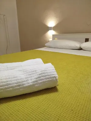 Letto o letti in una camera di Casa del Pescatore