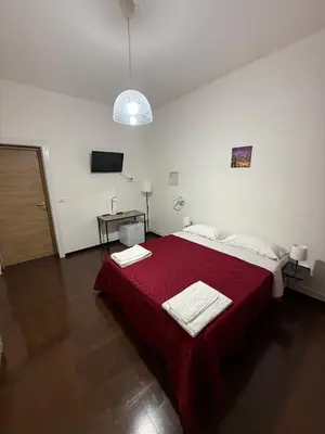 Letto o letti in una camera di Sc Residence Parma