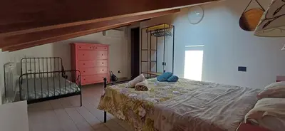 Letto o letti in una camera di Sofia e Ninì holiday house