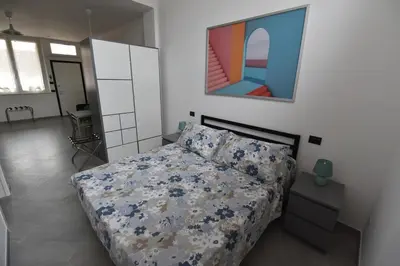 Letto o letti in una camera di Appartamento Emilio- Migliarina Station
