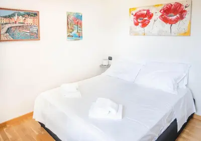 Letto o letti in una camera di Beaches, Sea, and Montallegro Panoramic Cable Car