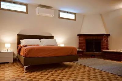 Letto o letti in una camera di B&B Villa Sassuolo by EUROMODENA