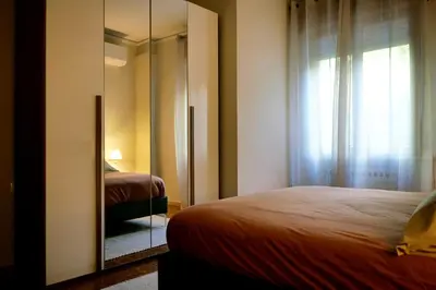 Letto o letti in una camera di B&B Villa Sassuolo by EUROMODENA