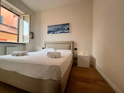 Letto o letti in una camera di ORO Apartment, Rapallo