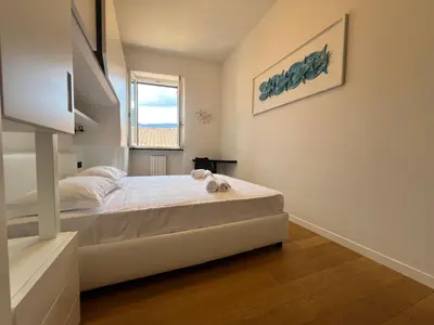 Letto o letti in una camera di ORO Apartment, Rapallo